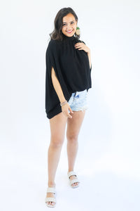 Top Notch Shift Top In Black